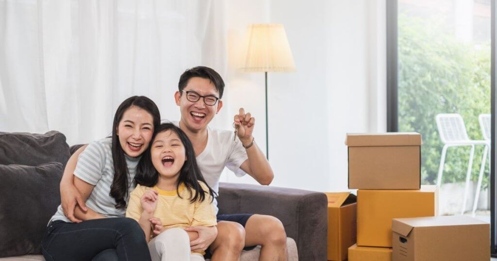 Happy homeowners in Singapore representing bridging loan assistance from the best moneylender in Singapore for smooth property purchases.