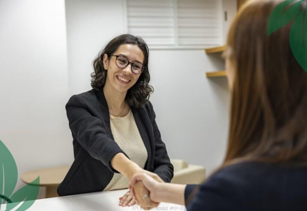 Complete Your Loan Process for a Debt Consolidation Loan Singapore, showing a customer meeting with a loan consultant to finalise the loan agreement after successful eligibility assessment at Moneyplus Capital.