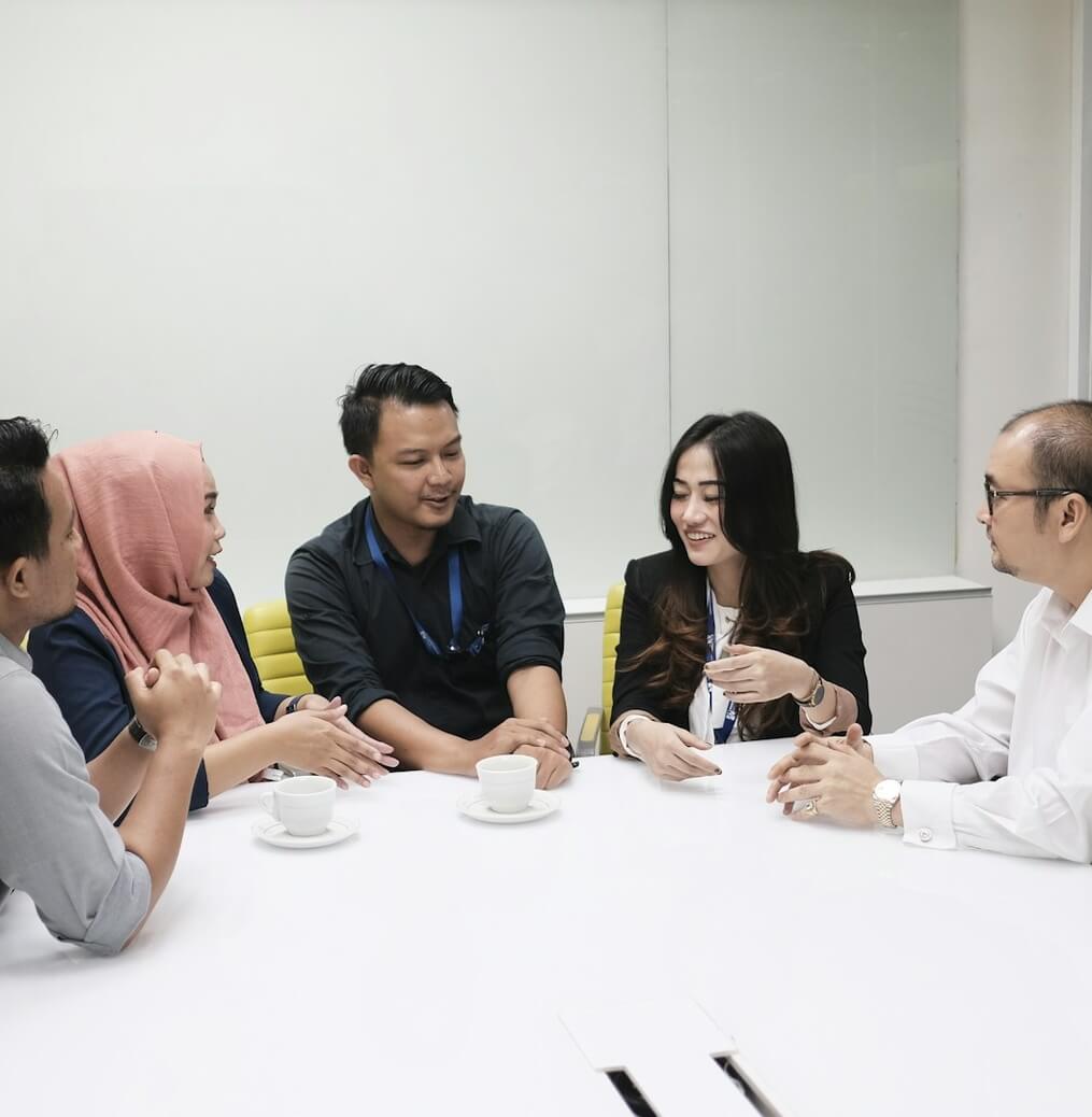 Loan consultant discussing Bad Credit Loan Singapore options with a customer at Moneyplus Capital
