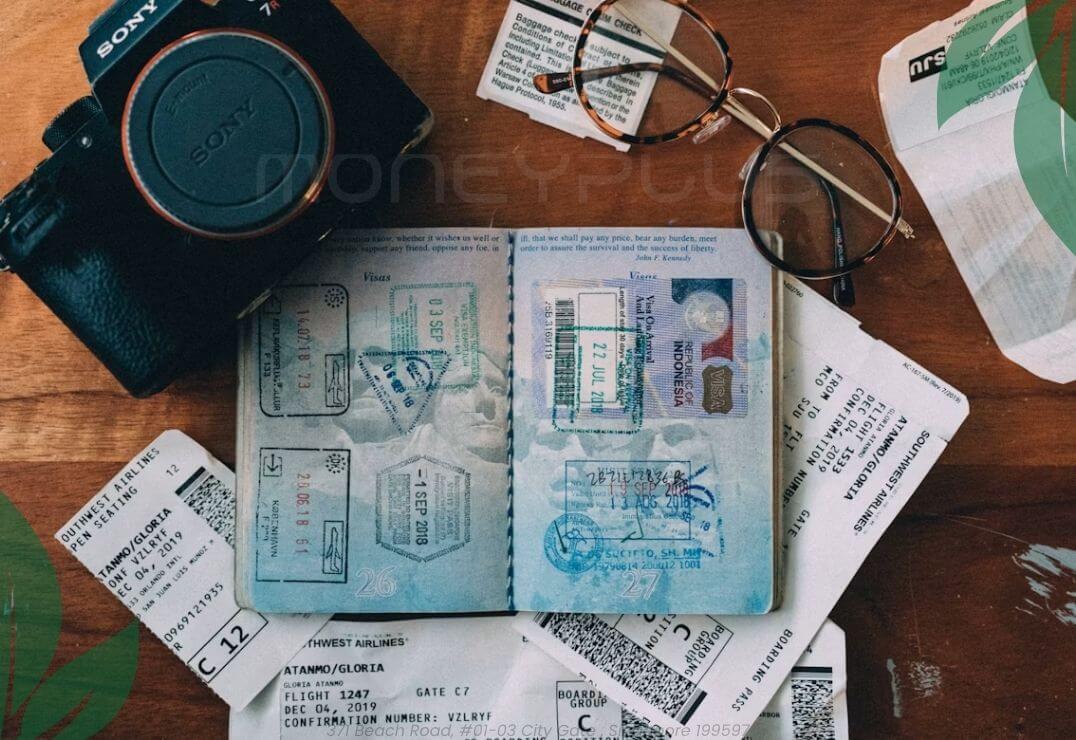 Travel Loan Singapore illustration featuring a passport, boarding passes, travel documents, camera, and travel accessories, representing responsible travel planning and financing by Moneyplus Capital Singapore.